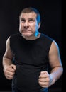 Brutal man actor gesticulates and grimaces. Royalty Free Stock Photo