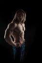 Brutal man bodybuilder athlete with long hair