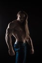 Brutal man bodybuilder athlete with long hair
