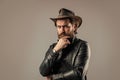 Brutal man cowboy hat leather jacket, making decision concept Royalty Free Stock Photo