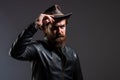 Brutal man cowboy hat leather jacket, masculinity concept Royalty Free Stock Photo