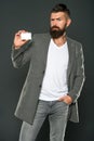 Brutal man with hipster beard. Bearded man. Male formal fashion. Businessman with credit card. Business fashion and