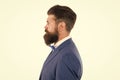 Brutal mature man with perfect haircut in profile. bearded hipster isolated on white. barbershop salon concept. grow