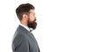 brutal mature man with perfect haircut in profile. bearded hipster isolated on white. barbershop salon concept. grow