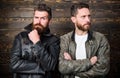 Brutal men wear leather jackets. Men brutal bearded hipster posing in fashionable black leather jackets. Leather fashion Royalty Free Stock Photo