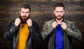 Brutal men wear leather jackets. Leather fashion menswear. Men brutal bearded hipster posing in fashionable black Royalty Free Stock Photo