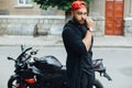 Brutal and muscular beard biker on the motorcycle