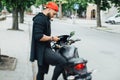 Brutal and muscular beard biker on the motorcycle