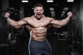 Brutal strong bodybuilder athletic men pumping up muscles with d