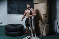 Brutal strong athletic men bodybuilder trains in the gym
