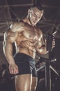 Brutal strong athletic men pumping up muscles workout bodybuilding concept