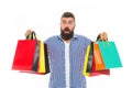 Brutal surprised caucasian hipster with moustache. Mature hipster with beard. Bearded man with shopping bags.. Shopping
