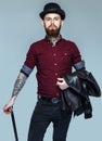 Brutal tattoed male with cane Royalty Free Stock Photo