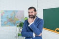 brutal unshaven guy university lecturer in classroom, education Royalty Free Stock Photo