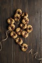 âBrutti ma buoniâ: homemade rustic biscuits. Some ingredients are: eggs; sugar; flour; butter, and chocolate, on wooden table