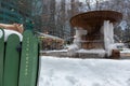 Bryant Park Logo on a Garbage Can with the Fountain Frozen during the Winter in New York City Royalty Free Stock Photo