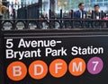 Bryant Park NewYork Subway Sign Business Men Corporate Workers in the Background Royalty Free Stock Photo