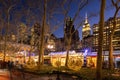 Bryant Park Winter Village Christmas Market in evening with the Empire State Building. New York City, Manhattan, Midtown Royalty Free Stock Photo