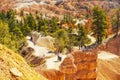 Bryce Canyon National Park hiking trail, Utah. Aerial view Bryce Canyon valley with walking tourists