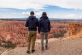 Bryce Canyon - Rear view of loving couple in hoodies with aerial view of massive hoodoos in Bryce Canyon National Park, Utah, USA