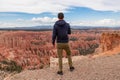 Bryce Canyon - Rear view of man in hoodie with aerial view of massive hoodoos in Bryce Canyon National Park, Utah, USA Royalty Free Stock Photo