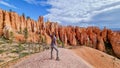 Bryce Canyon - Woman with scenic aerial view of hoodoo sandstone rock formations on Queens Garden trail in Utah, USA Royalty Free Stock Photo