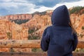 Bryce Canyon - Woman with scenic aerial view of hoodoo sandstone rock formations seen from sunrise point in Utah, USA Royalty Free Stock Photo