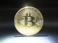Btc gold coin on lighting, bitcoin cryptocurrency closeup Royalty Free Stock Photo