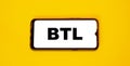 BTL on smartphone screen, meaning Below-the-Line, giveaway in stores