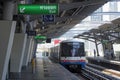 BTS Sky Train is leaving the station platform in Nana station, Bangkok