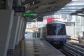 BTS Sky Train is running in downtown pass through skycrapers business building in Bangkok