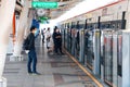 BTS Skytrain Bangkok passengers wait for the train on the platform. Royalty Free Stock Photo