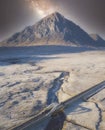 Buachaille Etive Mor aerial view at night during winter frost moor with stars in sky highlands landscape and A82 road bridge at Gl Royalty Free Stock Photo