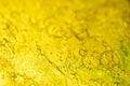 Bubble abstract yellow lubricant gel texture. Viscous petrolatum - macro photo