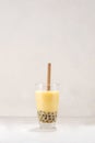 Bubble boba tea with milk and tapioca pearls in glass on white background Royalty Free Stock Photo