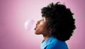 Bubble gum, afro hair and black woman on pink studio background with fashion, cool or Jamaican trend hairstyle. Profile