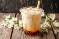 Bubble milk tea displayed on wooden background, enticing beverage concept Royalty Free Stock Photo