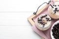 Bubble milk tea with tapioca balls on white wooden table, top view. Space for text