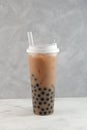 Bubble milk tea, tapioca milk tea, or boba drink. Disposable plastic cup. Take away street fast food Royalty Free Stock Photo