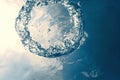 Bubble ring Underwater ascends towards the sun. Royalty Free Stock Photo