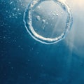 Bubble ring Underwater ascends towards the sun. Royalty Free Stock Photo