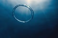 Bubble ring Underwater ascends towards the sun Royalty Free Stock Photo