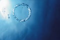 Bubble ring Underwater ascends towards the sun Royalty Free Stock Photo