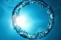 Bubble ring Underwater ascends towards the sun Royalty Free Stock Photo
