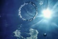 Bubble Ring Underwater ascends towards the Sun Royalty Free Stock Photo