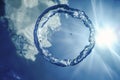 Bubble Ring Underwater ascends towards the Sun Royalty Free Stock Photo