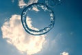 Bubble ring Underwater ascends towards the sun. Royalty Free Stock Photo