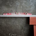 Bubble spirit level tool in red on costruction cement Royalty Free Stock Photo