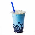 bubble tea glass with blue blueberry milk drink, ice cubes and bubbles.