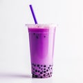 bubble tea glass with blueberry milk drink, ice cubes and bubbles.